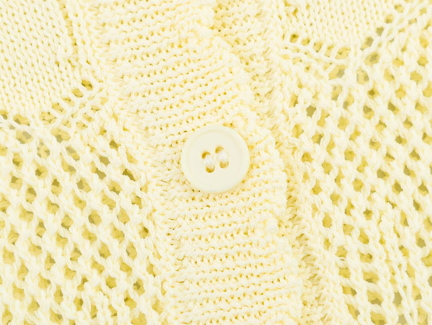 Women's short sleeved hollow knitted cardigan