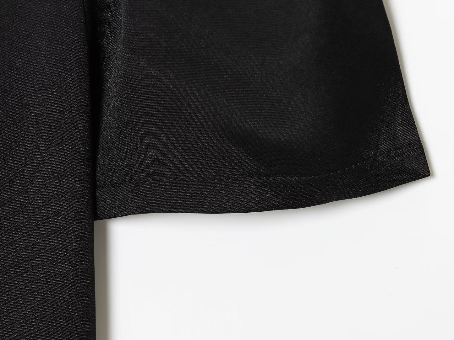 Women's black short sleeved pleated mini dress
