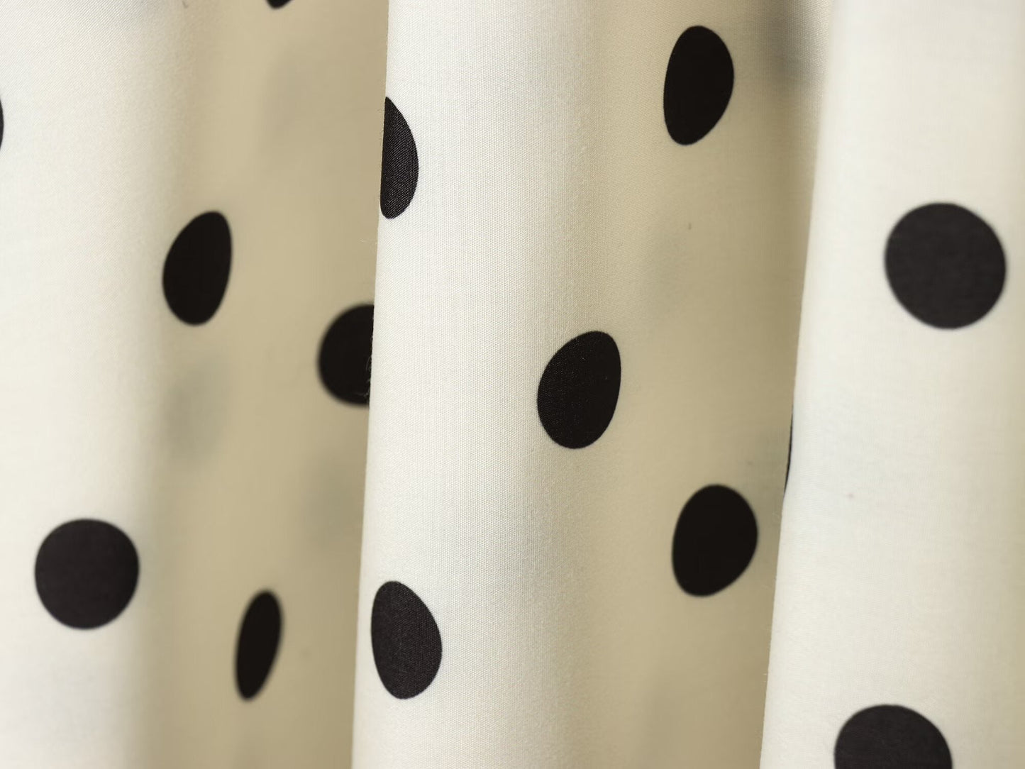 Women's asymmetrical polka dot MIDI skirt